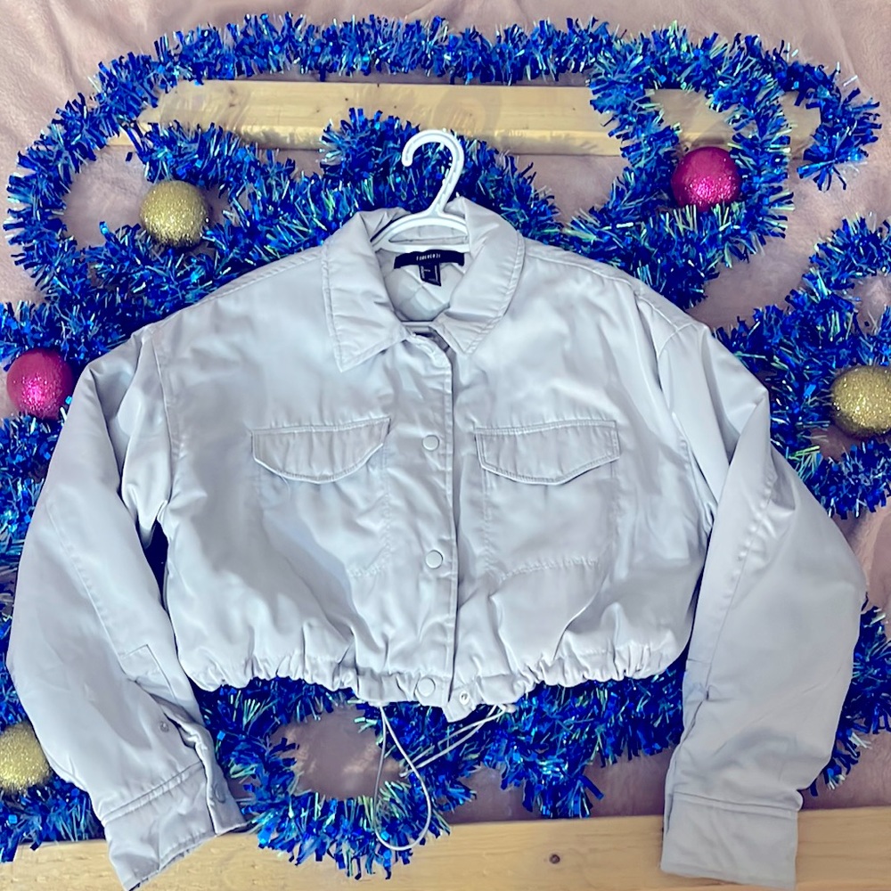this pretty crop bomber is a staple in any stylish closet.